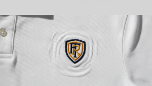 Too much push in embroidery showing fabric distortion on a white polo shirt