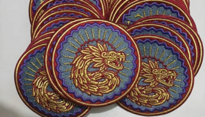 Detailed view of satin and fill stitches on fabric