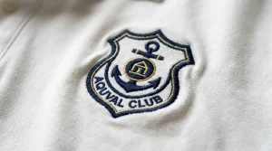 fabric distortion caused by too much push in embroidery on white polo shirt